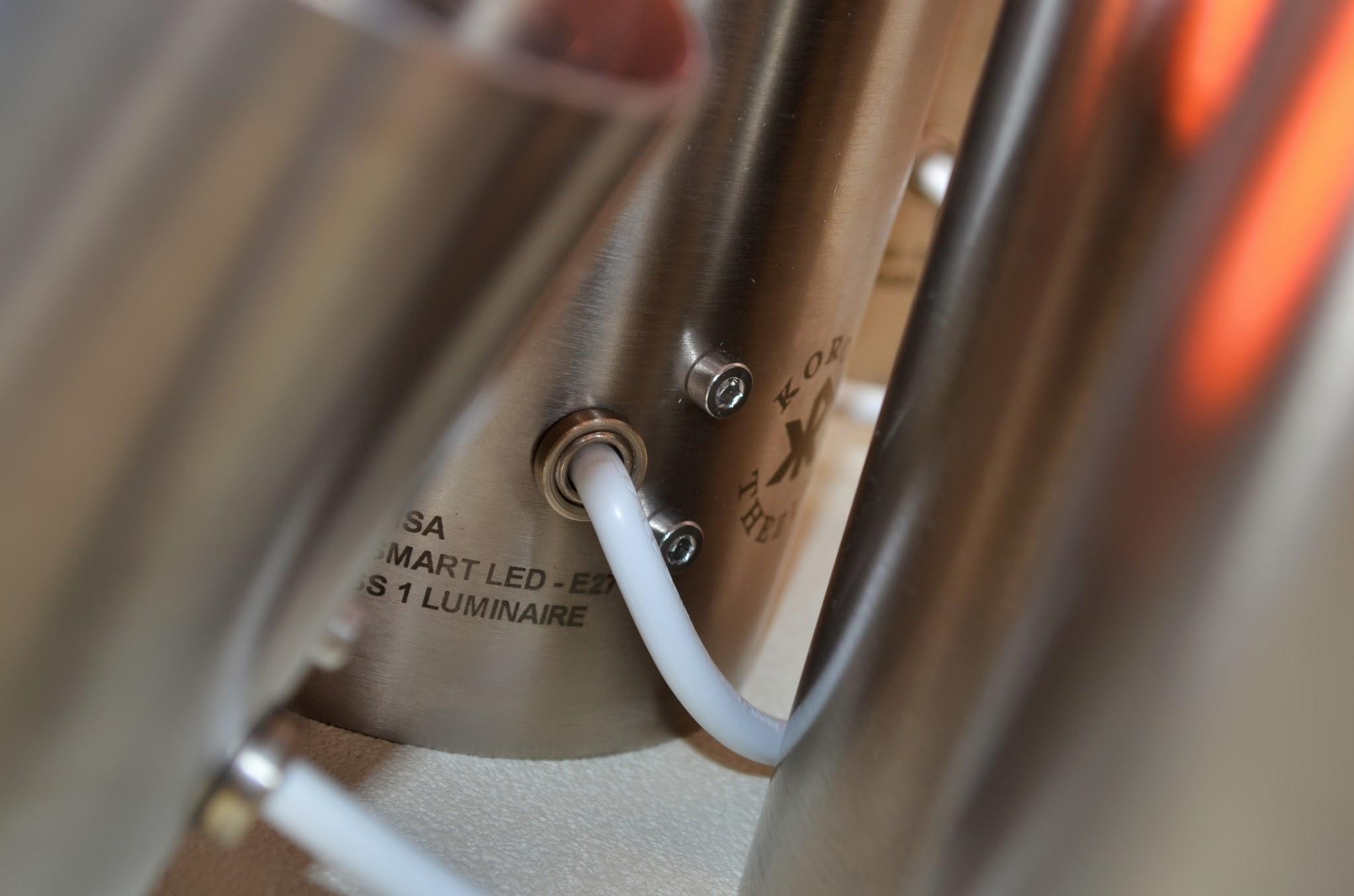 Close-up of the brushed stainless steel surface of a luminaire